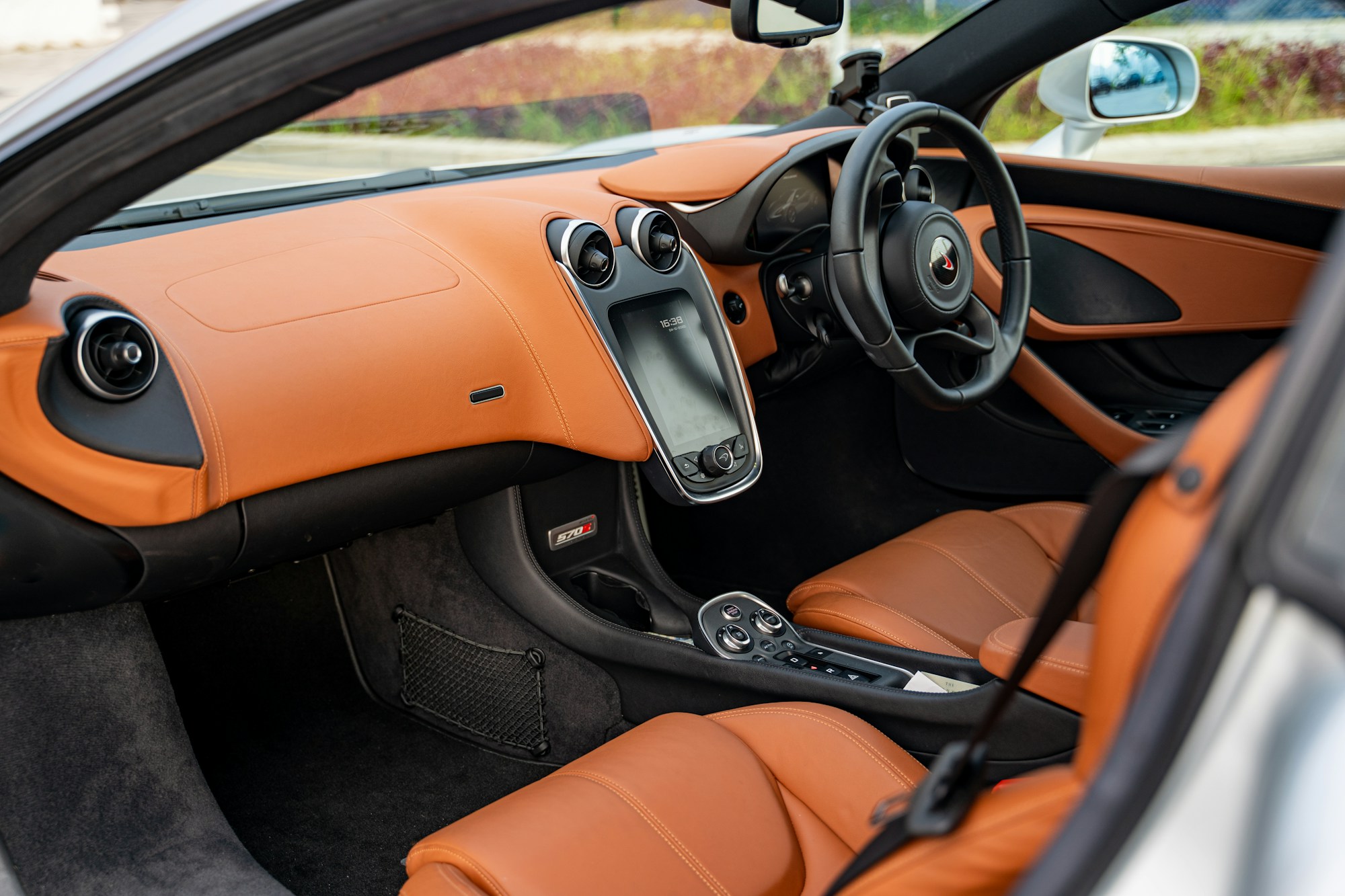 Close view of premium orange leather vehicle interior